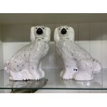 PAIR OF STAFFORDSHIRE SEATED SPANIEL FIGURES