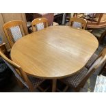 TEAK OVAL DINING TABLE AND SIX CHAIRS