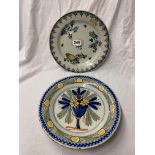 TWO DELFTWARE PLATES PAINTED WITH FLOWERS