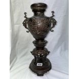 JAPANESE BRONZE TWIN HANDLED OVOID VASE ON ELEPHANT FACE TRIFORM BASE WITH COVER (FINIAL MISSING)