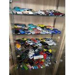 FIVE SHELVES OF UNBOXED DIECAST MODEL CARS - POLICE CARS, AEROPLANES,