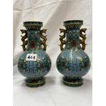 PAIR OF CHINESE CLOISONNE ENAMEL TWIN HANDLED HU SHAPED VASES DECORATED WITH FLOWERS 20CM H