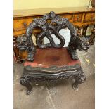CHINESE DRAGON CARVED ARMCHAIR OF SERPENTINE OUTLINE WITH RED LACQUERED SEAT