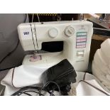 NEW HOME SEWING MACHINE WITH PEDAL