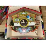 VINTAGE MINIATURE SWISS CUCKOO CLOCK WITH BOUNCING SWING DETAIL AND KEY