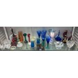 SHELF OF VARIOUS COLOURED AND CLEAR GLASSWARE INC.