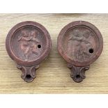 TWO TERRACOTTA ROMAN STYLE OIL LAMPS