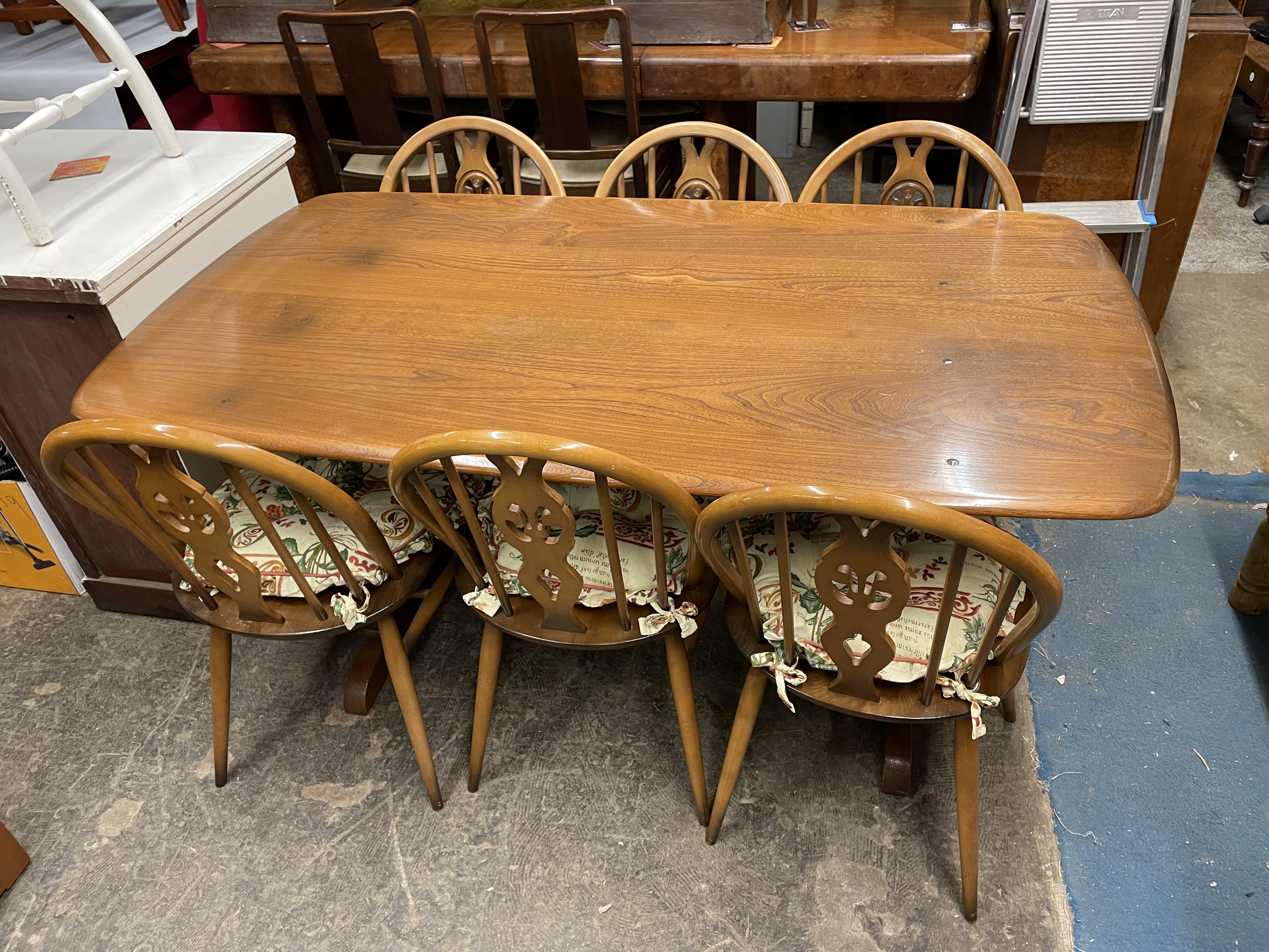 ERCOL ELM OBLONG DINING TABLE WITH SIX PRINCE OF WALES PLUME BACK CHAIRS