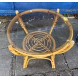 CIRCULAR BAMBOO AND RATTAN GLASS TOP TABLE AND AN OBLONG TABLE