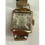 LADIES ARNEX 9CT GOLD CASED WRIST WATCH ON EXPANDING STRAP