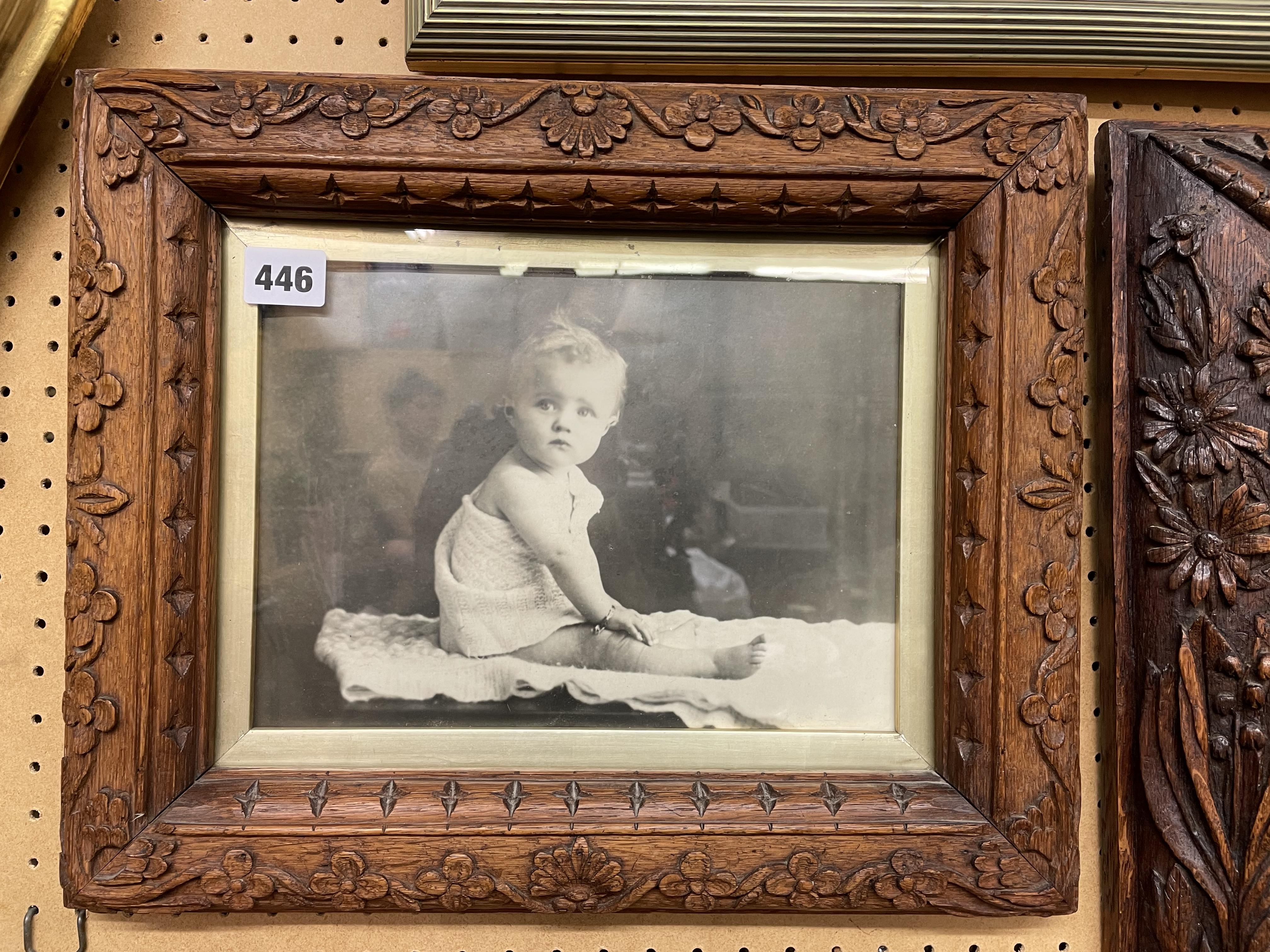 CHIP CARVED FOLIATE FRAMED PHOTOGRAPH OF A BABY 39CM X 32CM APPROX