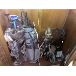 TWO BAGS OF MIXED GOLF CLUBS AND TWO TROLLEYS
