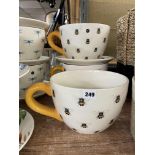 TWO BUMBLEBEE DESIGN OVERSIZED TEACUP AND SAUCER PLANTER SETS (AND ONE SPARE TEACUP)