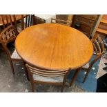 G PLAN TEAK CIRCULAR DINING TABLE AND SIX CHAIRS