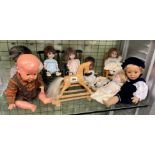 SHELF OF MINIATURE DOLLS, INCLUDING AM GERMAN HEADED EXAMPLES,