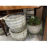 FOUR STONEWORK ROUND PLANTERS