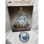 CHINESE BLUE AND WHITE SAUCER FROM THE NANKING CARGO WITH ACCOMPANYING AUCTION CATALOGUE FOR