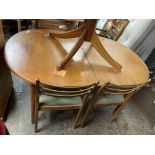 1970S TEAK OVAL DINING TABLE AND FOUR LADDER BACK CHAIRS