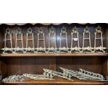 TWO SHELVES OF BRASS MINIATURE ART NOUVEAU TYPE EASEL BACK PHOTO HOLDERS