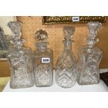 GOOD QUALITY PAIR OF CUT ETCHED WAISTED DECANTERS WITH STOPPERS AND TWO OTHER DECANTERS