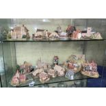 TWO SHELVES OF LILLIPUT LANE COTTAGE MODELS,