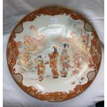 JAPANESE KUTANI SHALLOW DISH/CHARGER DECORATED WITH GEISHA IN A LANDSCAPE A/F TO RIM