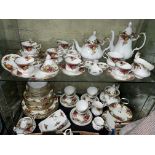 TWO SHELVES OF ROYAL ALBERT OLD COUNTRY ROSES TABLE WARES, CAKE STANDS, DINNER PLATES ,