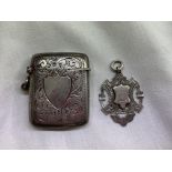 SILVER ENGRAVED VESTA CASE AND SILVER SHIELD SHAPE FOB