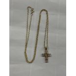 9CT MOONSTONE CROSS ON A FINE TRACE CHAIN 1.