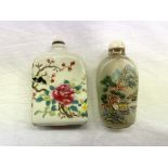 ONE GLASS SNUFF BOTTLE AND A CERAMIC EXAMPLE DECORATED WITH BLOSSOMS