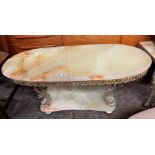 OVAL ONYX AND GILT METAL DOLPHIN BASE COFFEE TABLE