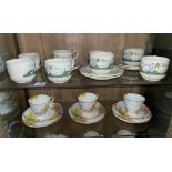 SHELF WITH POTTERY DUCK COFFEE SERVICE AND THREE FLORAL BONE CHINA TRIOS