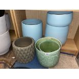 BOTTOM SHELF OF AQUA AND GREEN PLANTERS