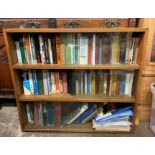 OAK SLIDING DOOR BOOKCASE AND BOOKS