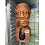 TRIBAL ART WOODEN CARVED BUST OF A MAN SMOKING A PIPE