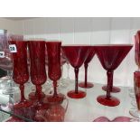FOUR RUBY COCKTAIL GLASSES AND FOUR FLUTES