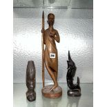 TRIBAL AFRICAN WOODEN CARVING OF A MAN SMOKING A PIPE AND TWO OTHER HARD WOOD CARVINGS ONE OF A