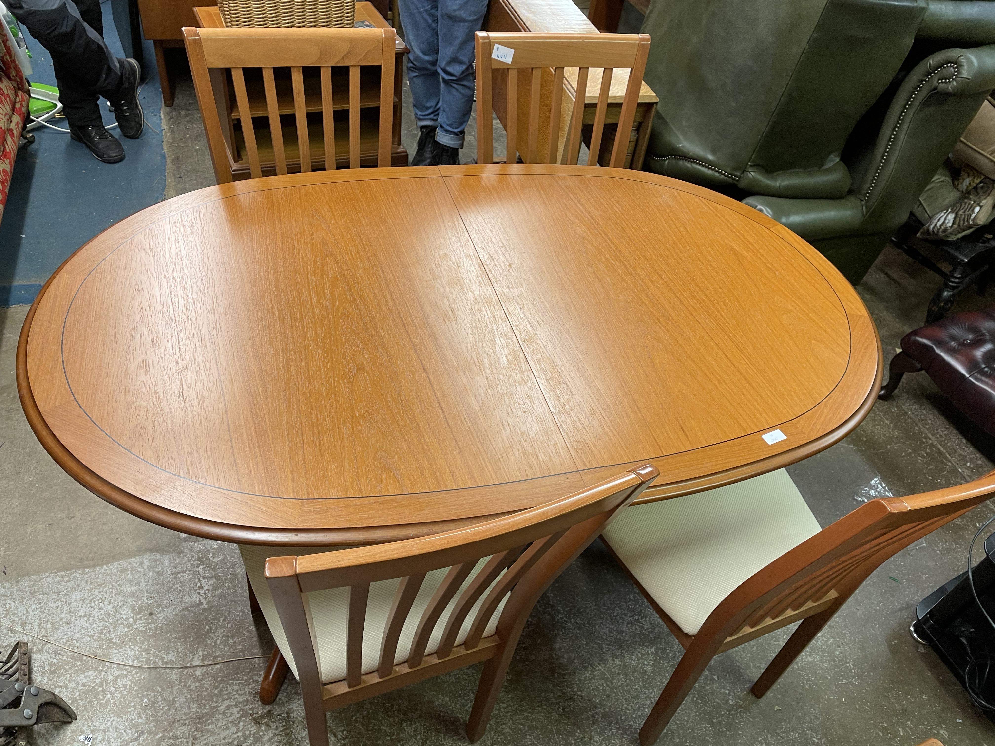 TEAK CROSSBANDED OVAL DINING TABLE AND FOUR CHAIRS