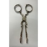 PAIR OF LATE GEORGIAN SILVER SUGAR NIPS 1.