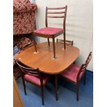 1970S TEAK EXTENDING DINING TABLE AND FOUR CHAIRS