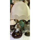 SEATED FIGURAL TABLE LAMP ON WOODEN BASE