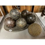 SEVEN METAL DECORATED BALLS ON METAL TRAY