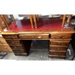 DARK STAINED PINE NINE DRAWER KNEEHOLE DESK WITH RED LEATHER GILT TOOLED SCIVER
