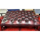 OXBLOOD BUTTON TOPPED LEATHER FOOTSTOOL ON CABRIOLE LEGS