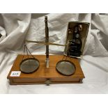 BOXED MINI MICROSCOPE AND A BRASS SET OF WEIGHING SCALES WITH WEIGHTS ON WOODEN BASE DRAWER A/F