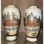 PAIR OF JAPANESE SATSUMA OVOID VASES DECORATED WITH PAGODA LANDSCAPES HEIGHT 16CM