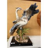 RESIN MODEL OF A PAIR OF HERONS ON A WOODEN BASE