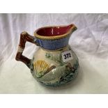 MAJOLICA GLAZED JUG WITH ANGULAR HANDLE DECORATED WITH FISH