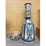 PERSIAN IZNIK FOOTED POTTERY VESSEL WITH METAL RIM 32CM HEIGHT AND A SMALL POTTERY JUG