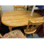 LIGHT WOOD EFFECT OVAL DINING TABLE AND FOUR BEECH SPINDLE BACK CHAIRS (SOME CHAIR STRETCHERS A/F)